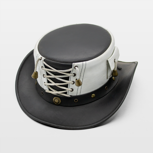 A black and white leather top hat with brass bell accents and decorative lacing on the band