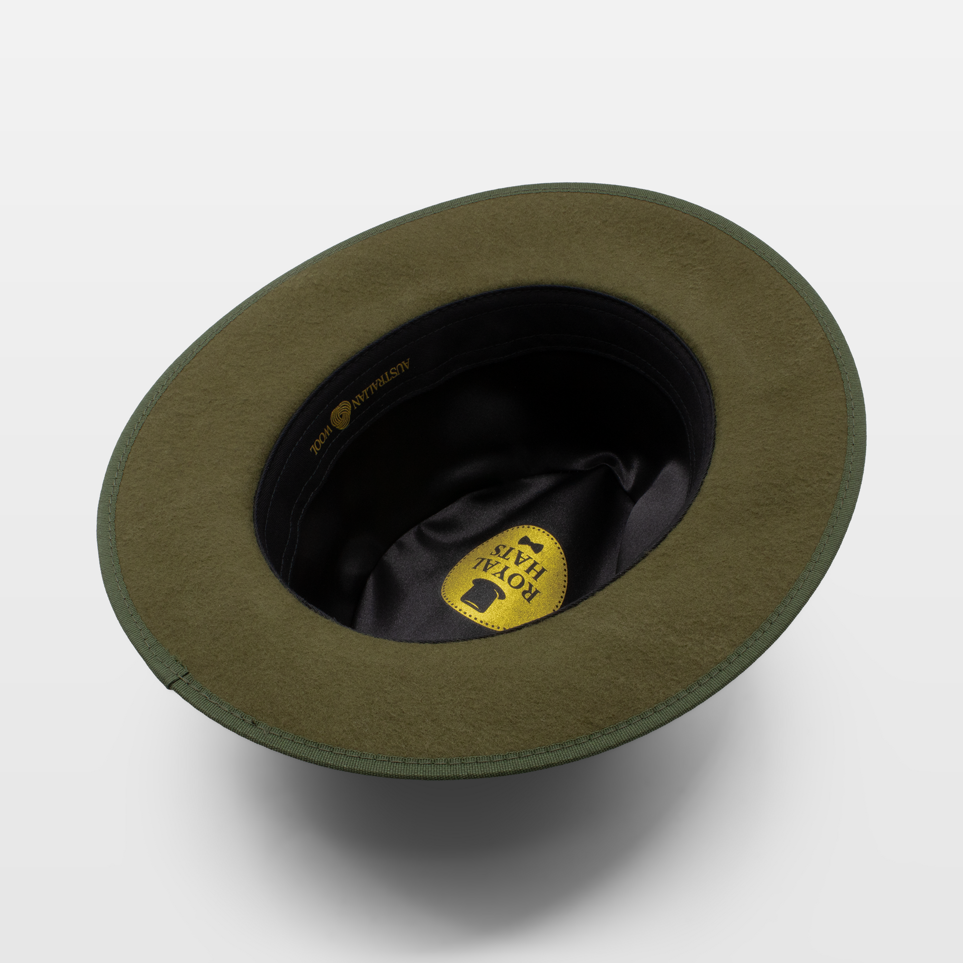 Green felt hat with a flat brim and black interior lining