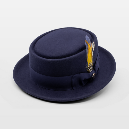 Navy blue hat with a yellow and black feather, adorned with a ribbon band and bow