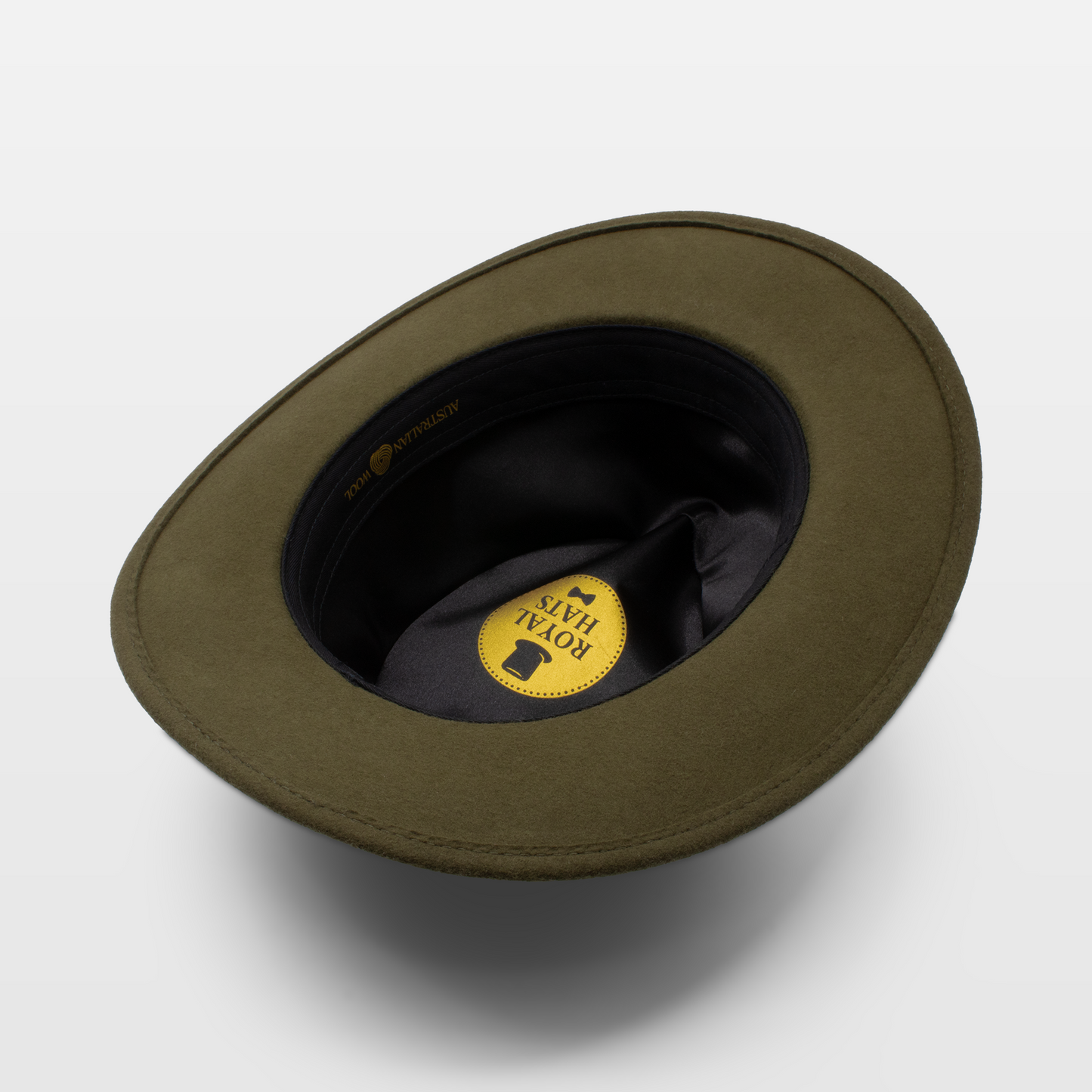 Interior view of an olive green felt hat showing the Royal Hats logo on the lining