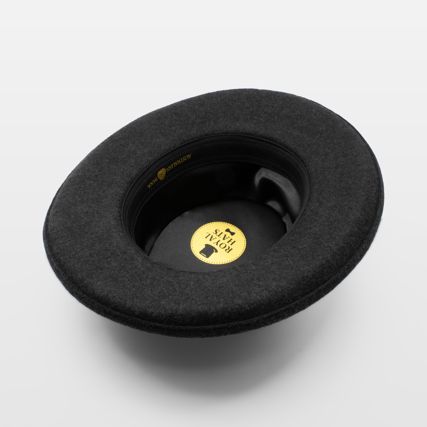 Interior view of a black felt hat with a Royal Hats label inside