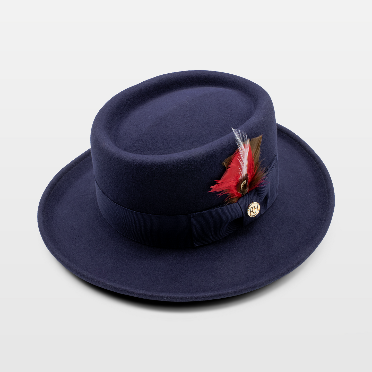 Navy blue hat with a decorative feather