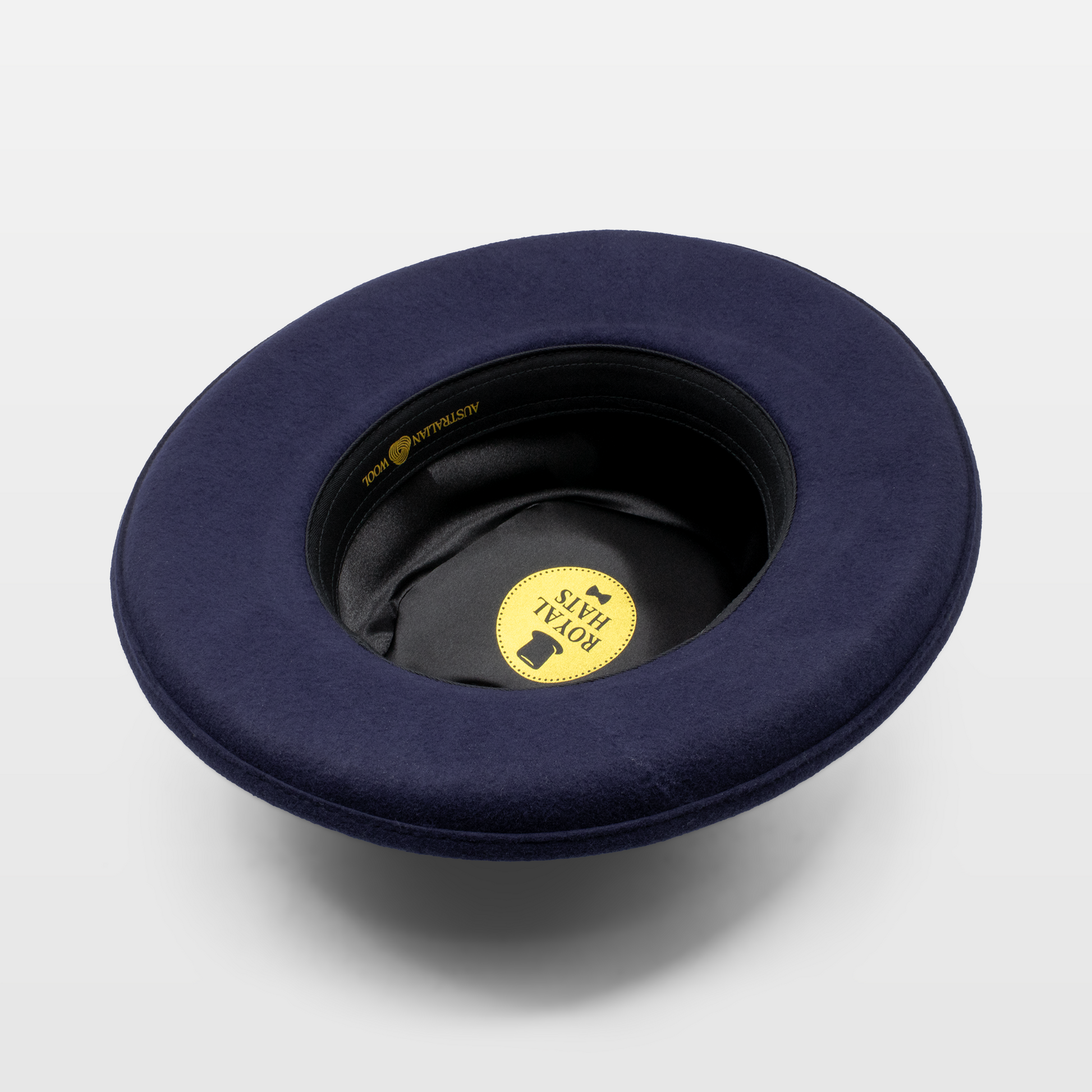 Blue hat with a black interior, featuring a 'Royal Hats' label inside