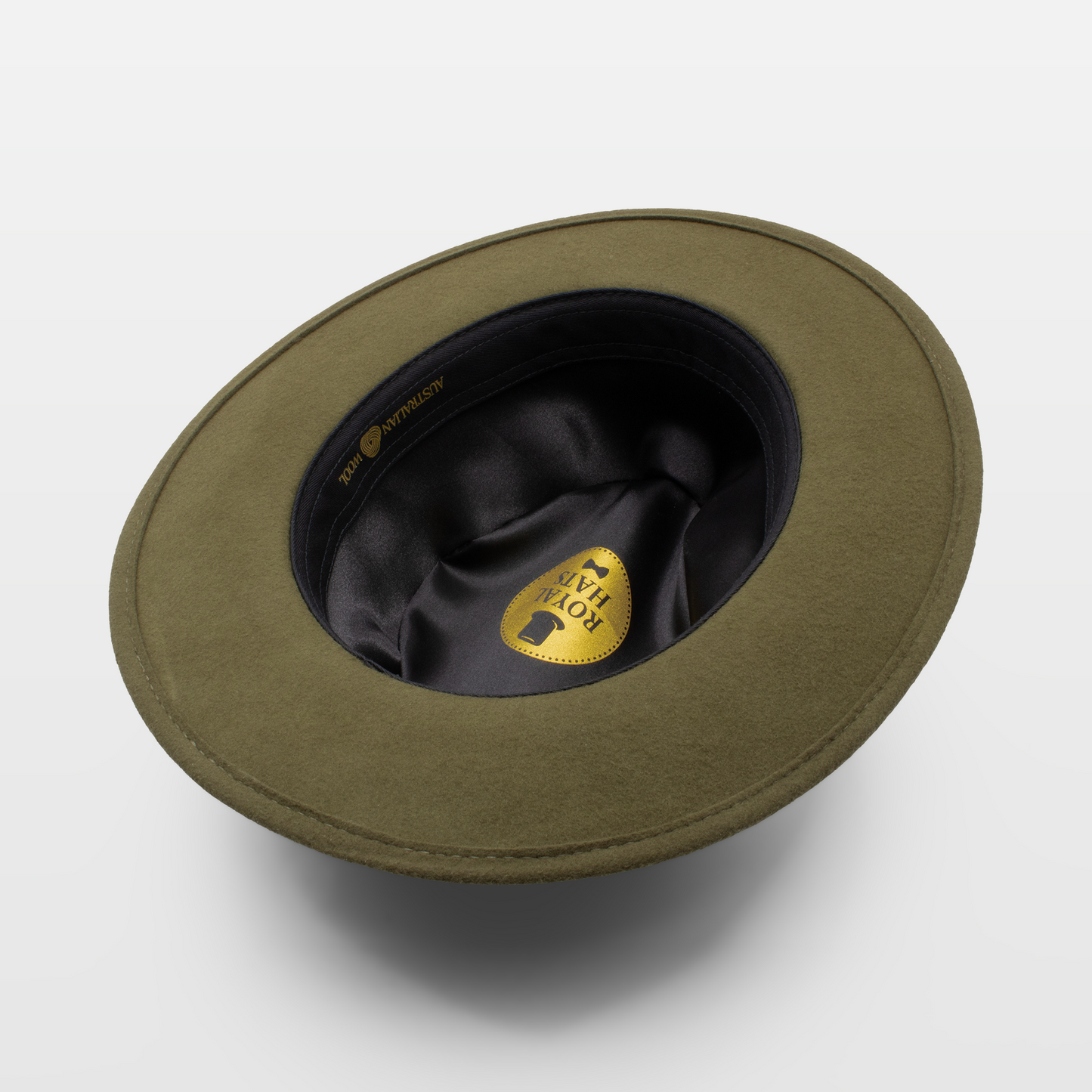 underside view of an olive-green hat with a black satin lining