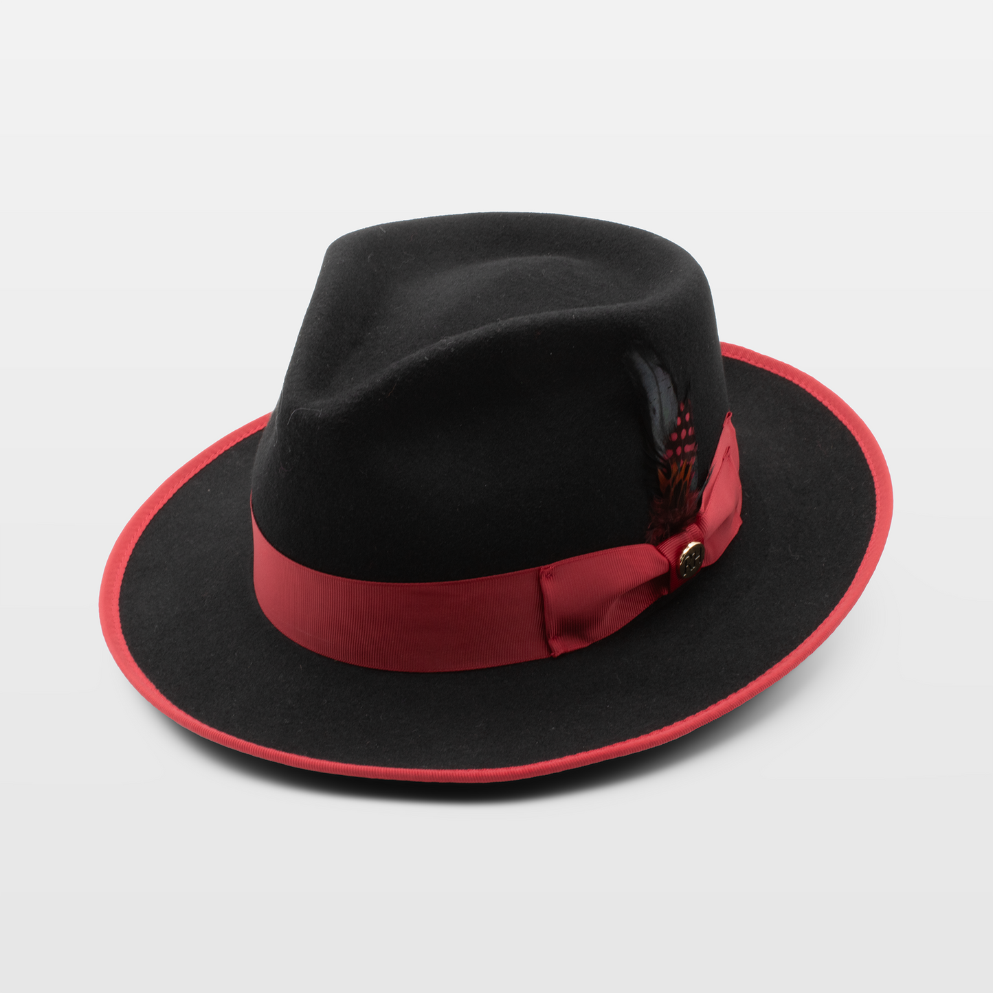 A stylish black hat with a red band and trim, featuring a decorative red feather