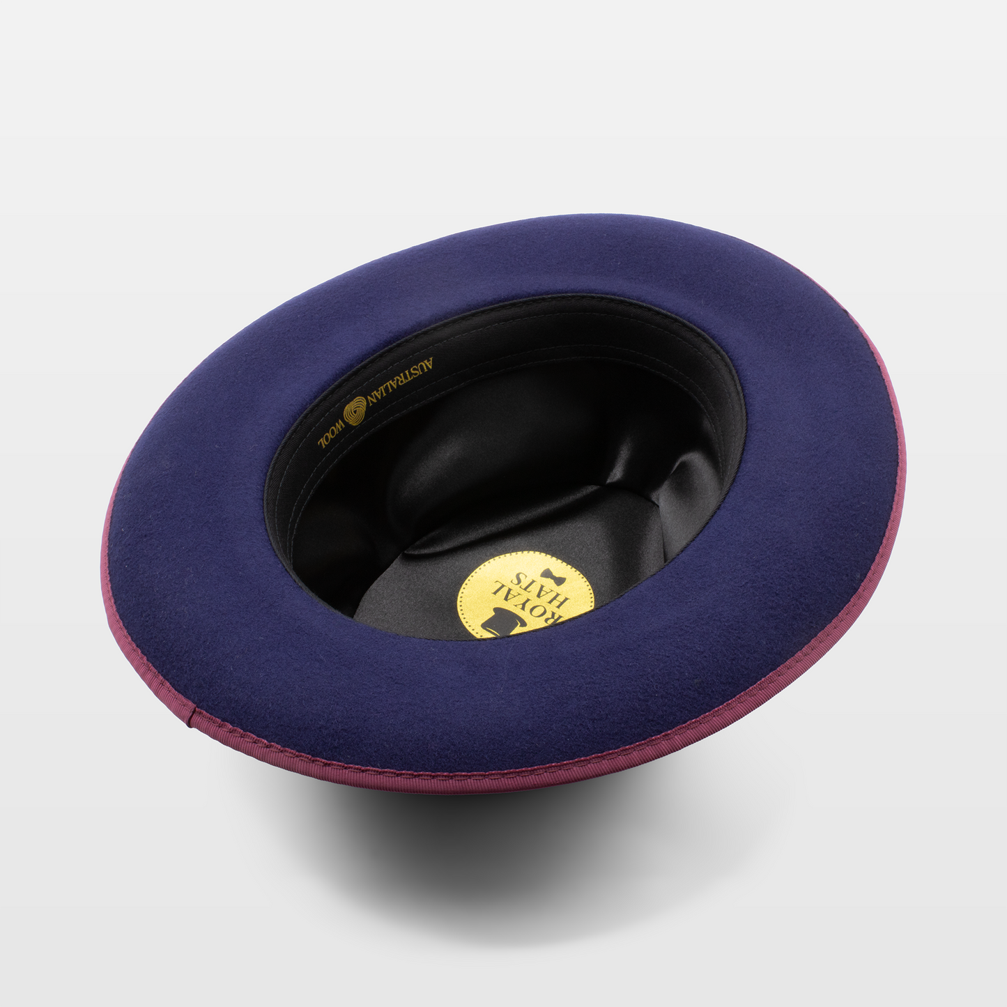 The inside view of a purple hat with a black interior