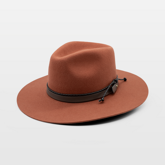 Rust-colored wide-brim hat with a leather band and knot detail