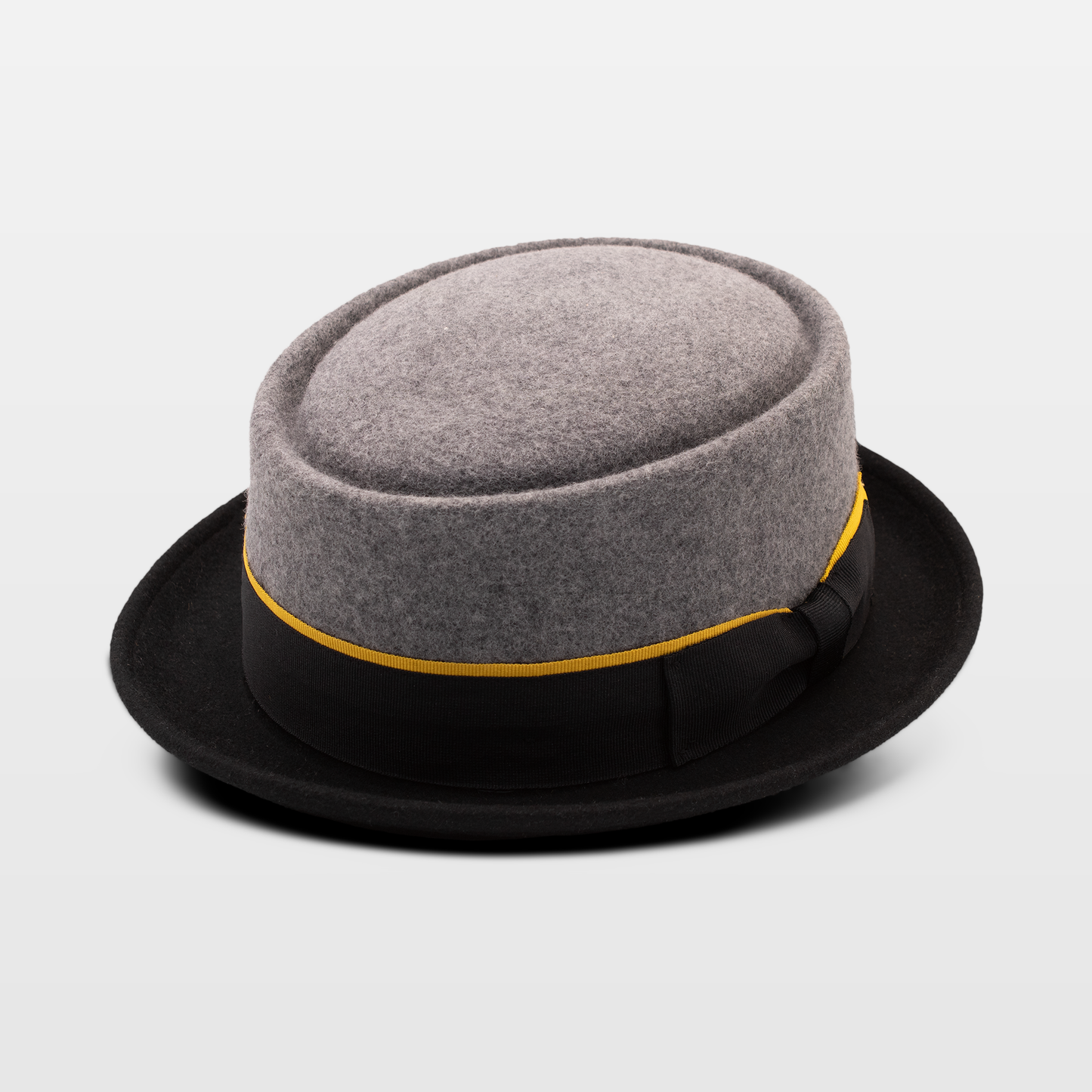 Stylish grey and black bowler hat with a gold-accented ribbon