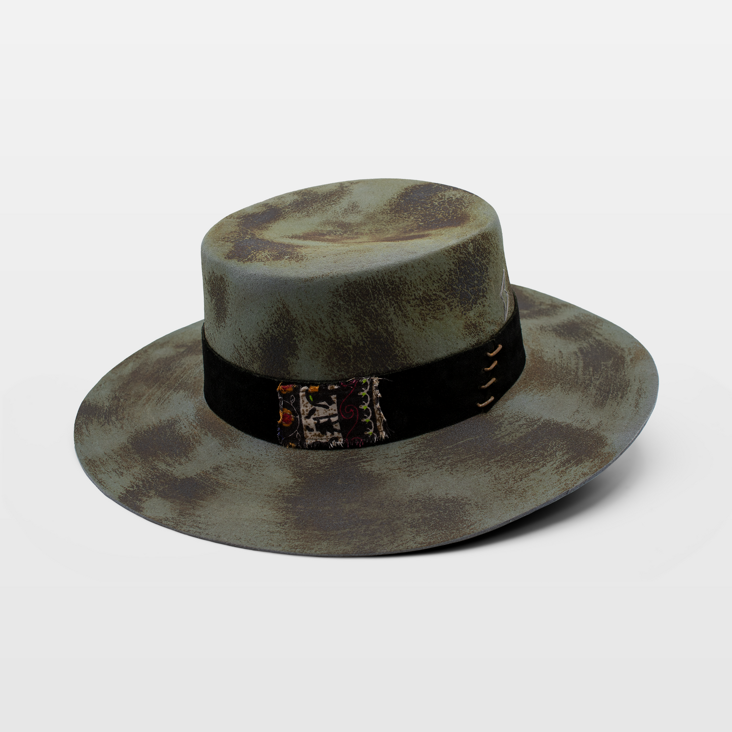 Grey wide-brimmed hat with a distressed look and a black band featuring embroidered details