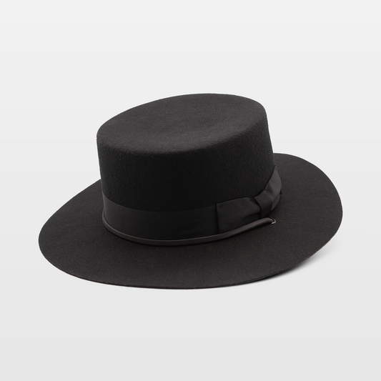 Black wide-brimmed hat with a flat top and a black ribbon band