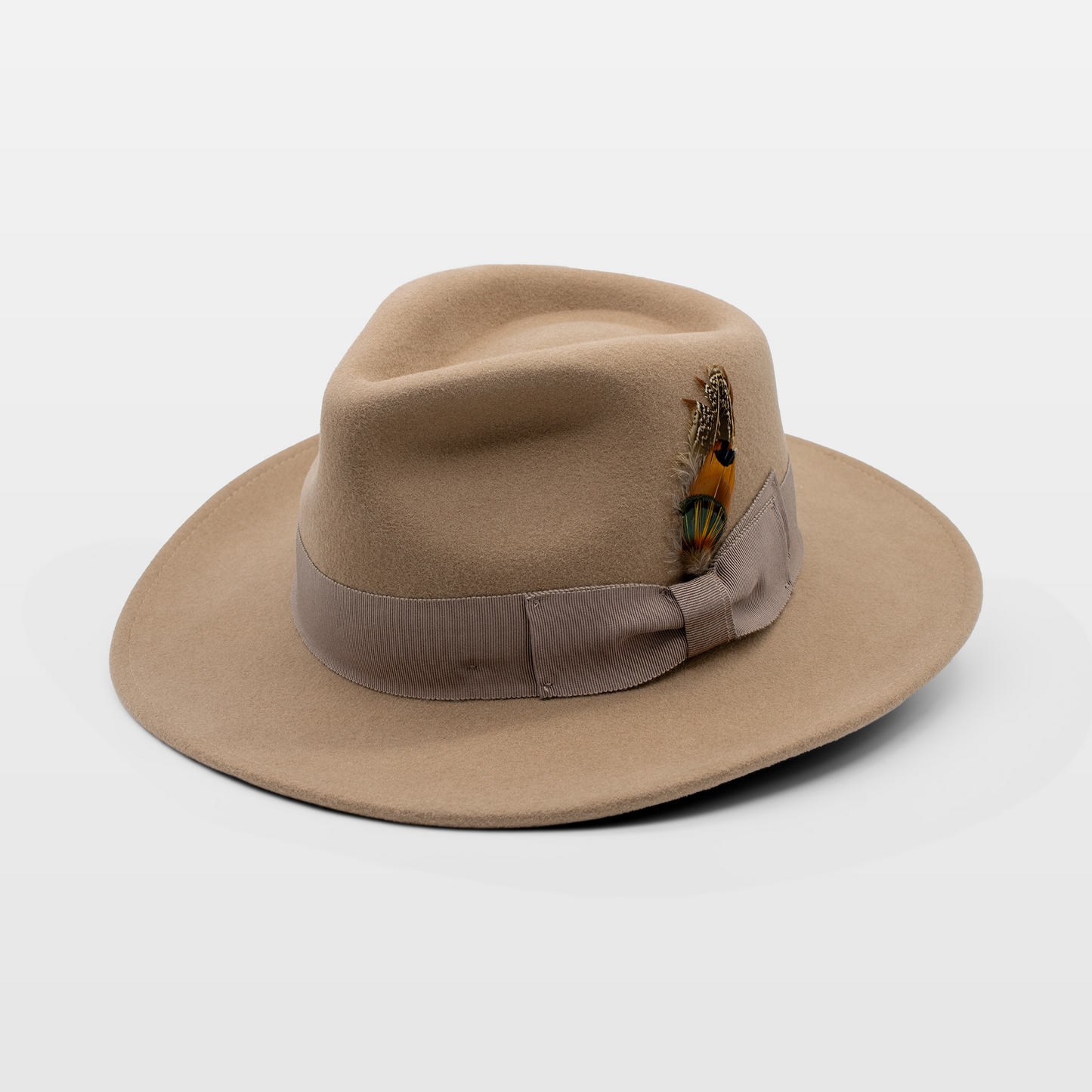 Beige fedora with a ribbon band and a small colourful feather accent