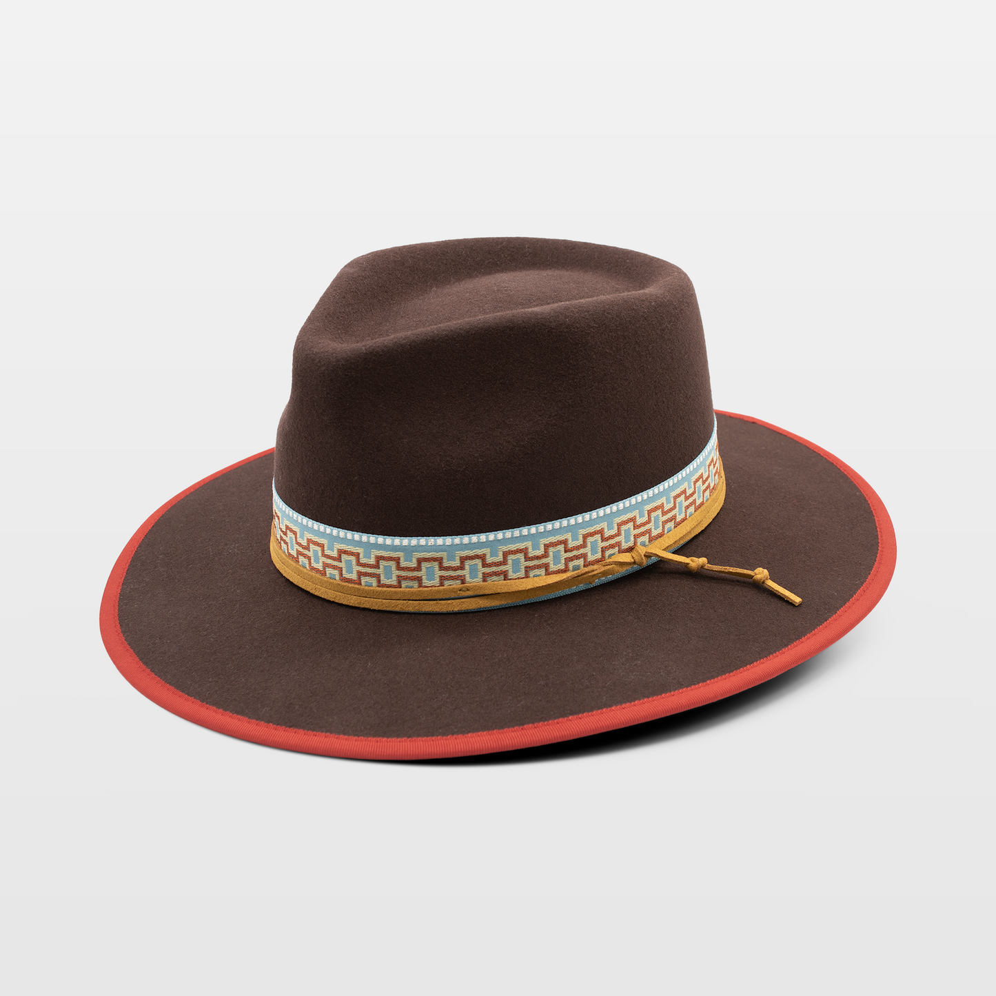 Brown wide-brim hat with a decorative patterned band and a red trim