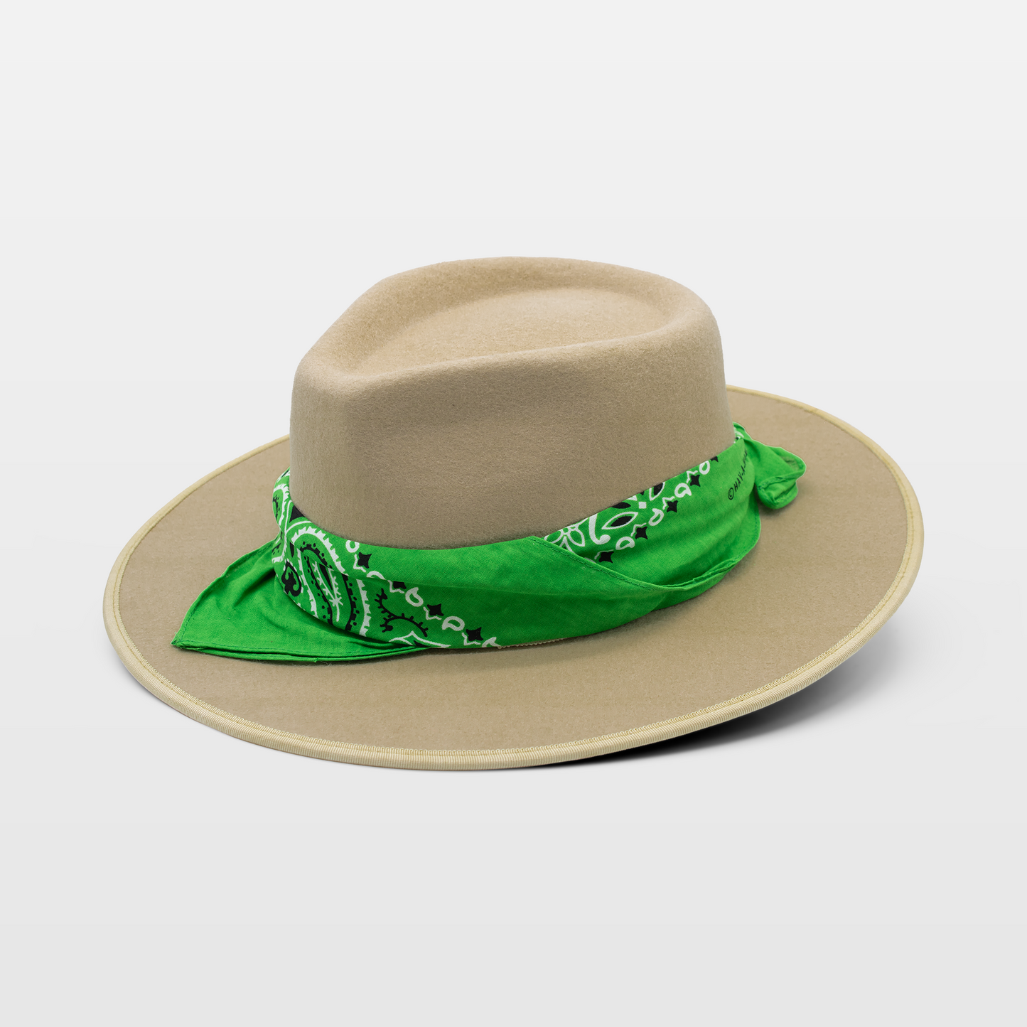 Tan fedora with a vibrant green bandana wrapped around the crown