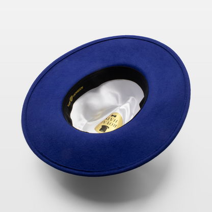 Blue wide-brimmed hat shown upside down to display the white satin interior