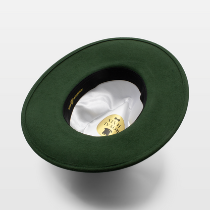 Green wide-brimmed hat shown upside down to display the white satin interior