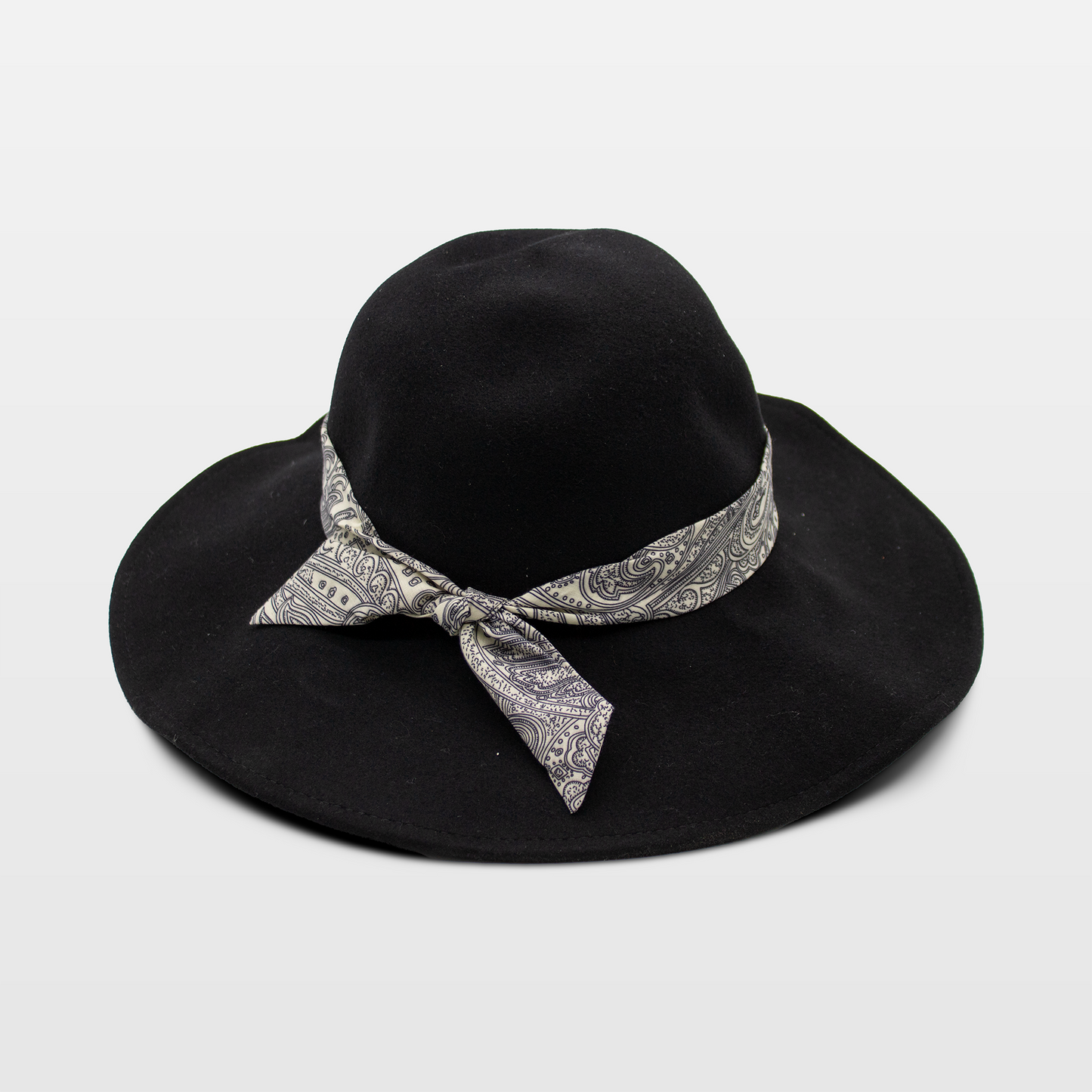 A stylish black hat with a wide brim, adorned with a paisley-patterned band tied in a bow