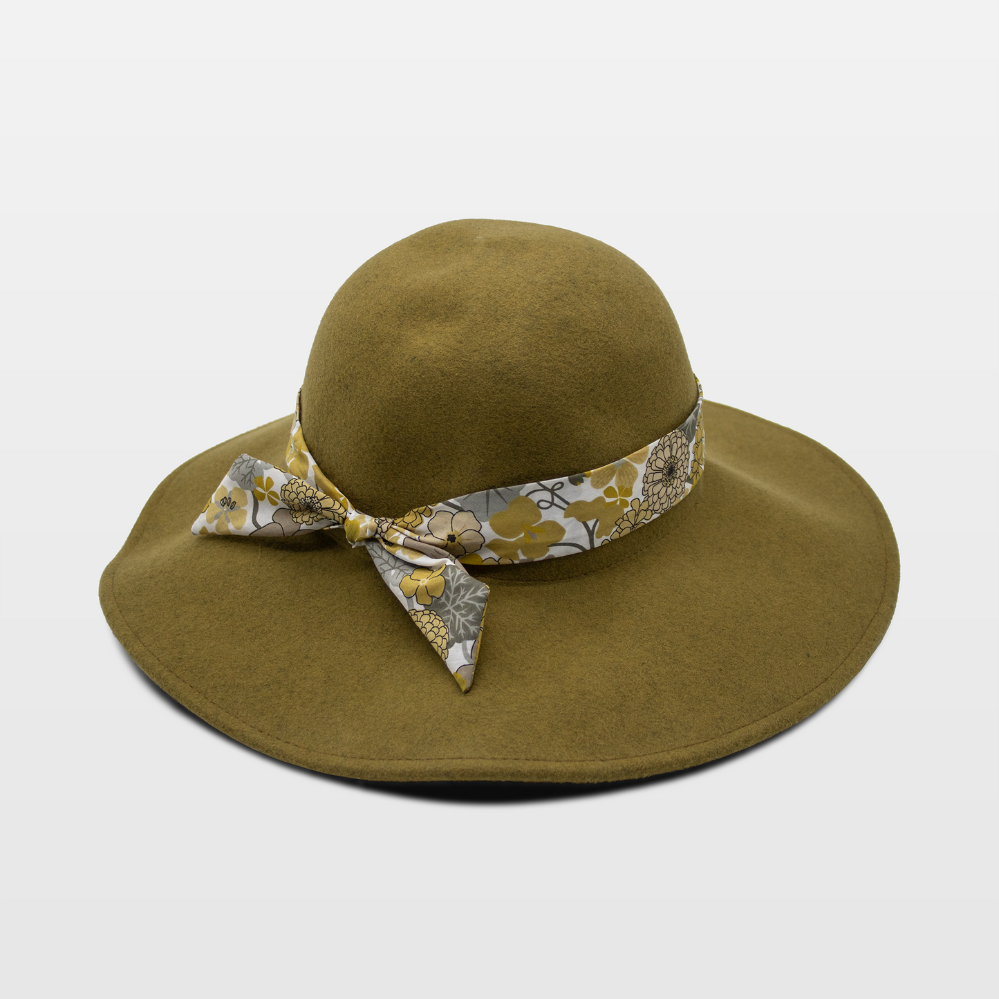 A stylish olive green hat with a wide brim, adorned with a floral-patterned band tied in a bow